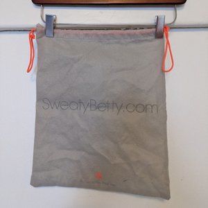 Sweaty Betty drawstring grey dust garment bag.